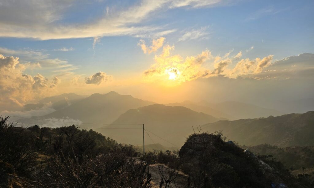 Sunset from Aal View Point, where the mountains stayed hidden but the sky still put on a show.